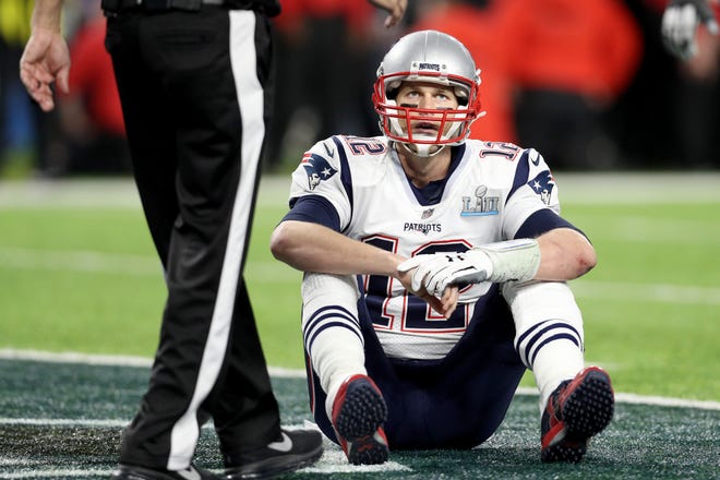 Tom Brady will lead the Tampa Bay Buccaneers against the Philadelphia Eagles in the first round of  the NFL playoffs on Sunday, his first time playing against them since losing to them in  Super Bowl LII at U.S. Bank Stadium on Feb. 4, 2018 in Minneapolis, Minnesota. Brady is pictured reacting to fumble during Super Bowl LII.