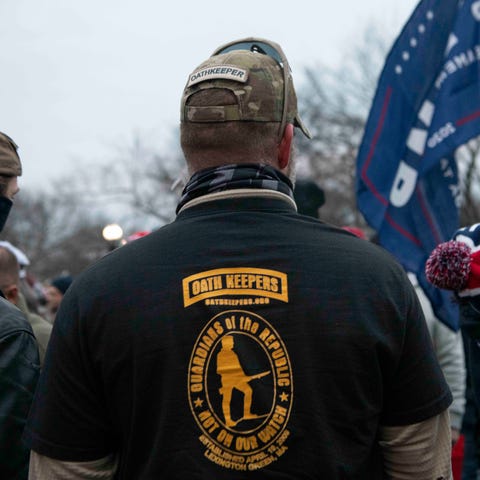 Men sporting gear identifying them as "Oath Keeper
