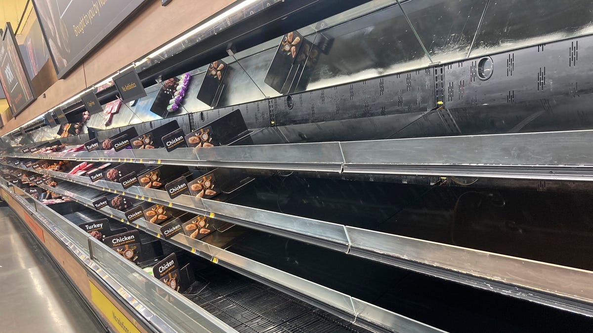 Shelves sit empty at a Walmart in Anchorage, Alaska, on Jan. 8, 2022. Shortages at U.S. grocery stores have grown in recent weeks.