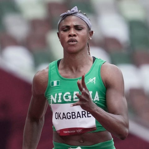 Blessing Okagbare, center, competes in the 100-met