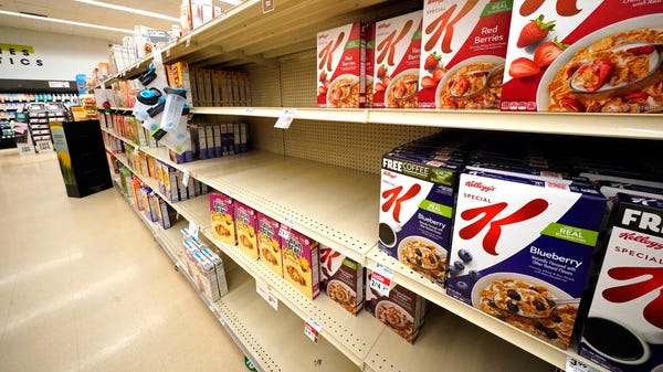 Shelves in the cereal aisle are partially empty at
