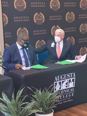 Augusta Technical College President Jermaine Whirl, left and University Hospital CEO Jim Davis signed a letter of intent Thursday to help train more nurses and other Allied Health professionals on University Hospital Summerville's campus.