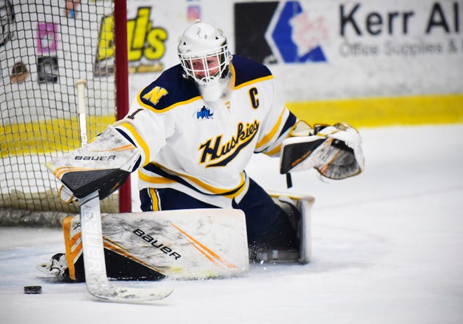 Port Huron Northern's Logan Sheffer blocks a shot during a game earlier this season. The senior currently has a save percentage of 92.3.