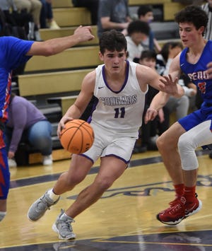 Spanish Springs' Jake Penney dribbles through traffic during a game against Reno on Jan. 10.