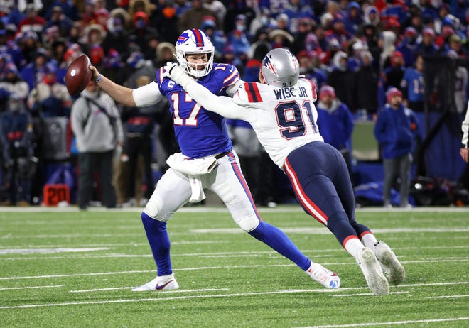 Bills quarterback Josh Allen fights off Patriots lineman Deatrich Wise Jr. during a Dec. 26 game.  Wise was continuing to apply the same kind of pressure to Panthers quarterbacks during Tuesday's joint practice at Gillette Stadium.