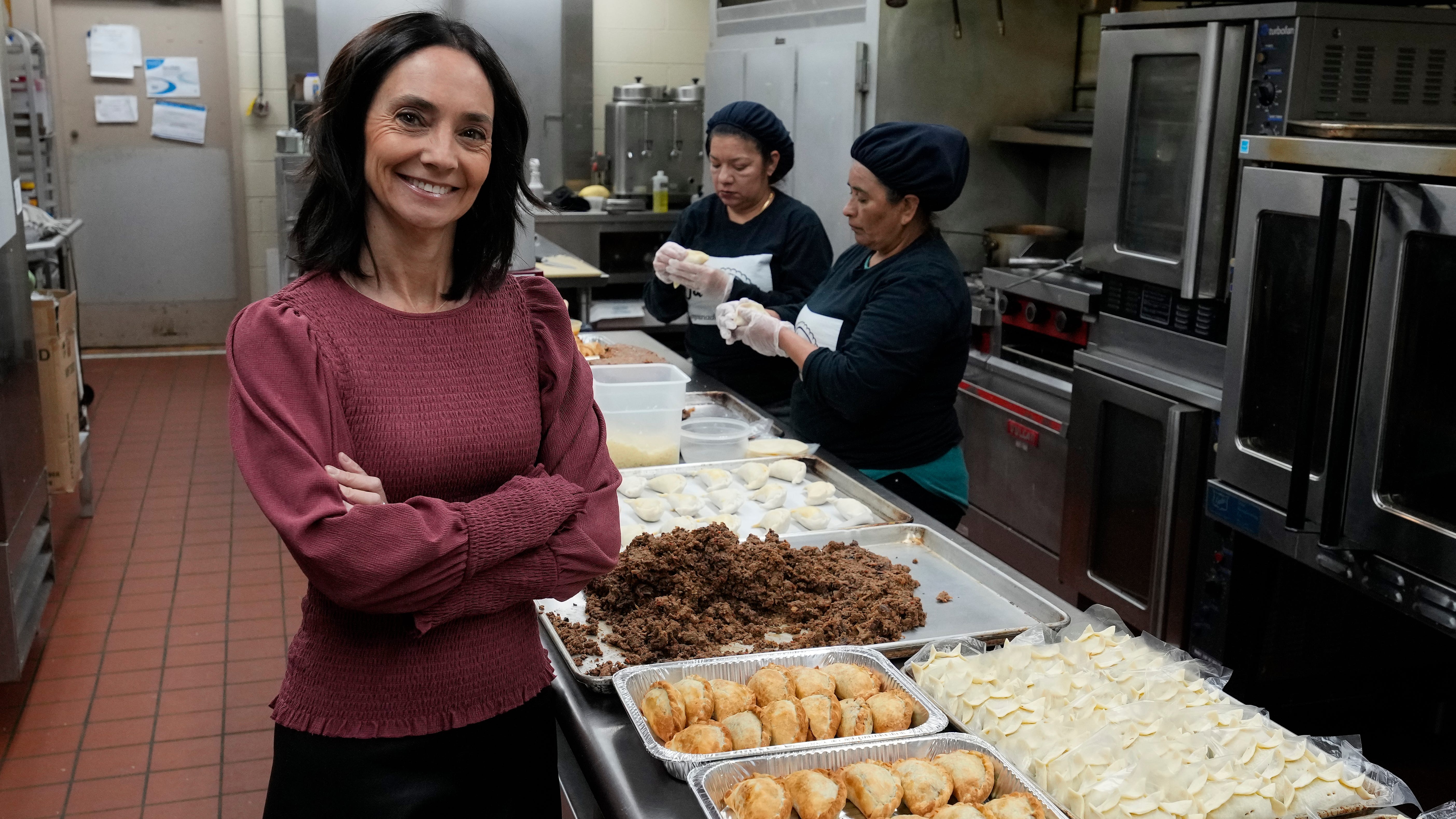 Jackie Mendive, owner of Empanadasonthego.com, poses for a picture at her commercial kitchen in Stamford, Conn. on Jan. 12, 2022. Mendive, 51, has owned a business that makes and sells empanadas since 2017. The idea was sparked by the positive reception the pastries received when she sold them to raise funds for a charity in Argentina, where she is originally from.