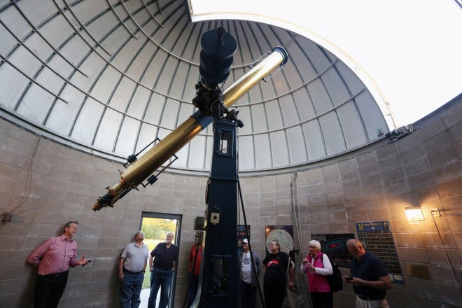 Burlington native and director of NASA Planetary Science Division Jim Green, left, talks about his career and the Alvan Clark telescope to Astronomy club members Aug. 23, 2017, at the John H. Witte Observatory at Big Hollow Recreation Area.