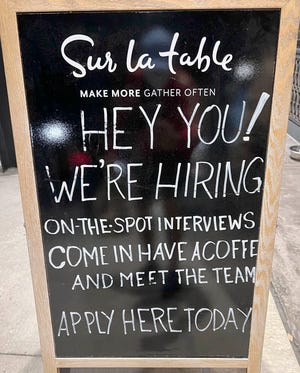 A help wanted sign promises "on the spot" interviews.