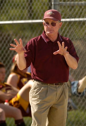 Brandywine High School softball coach Jim Myers flashes signs during a May 7, 2007 game. Myers is being inducted into the Michigan High School Softball Hall of Fame.