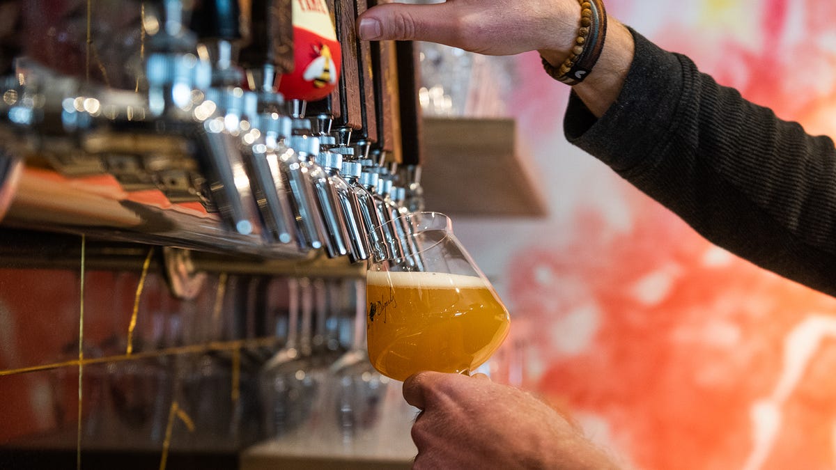 Sean Bowman, owner of Foreign Objects Brewery, pours a glass of beer at Foreign Objects Brewery in Monroe, NY, on Thursday, January 13, 2022.