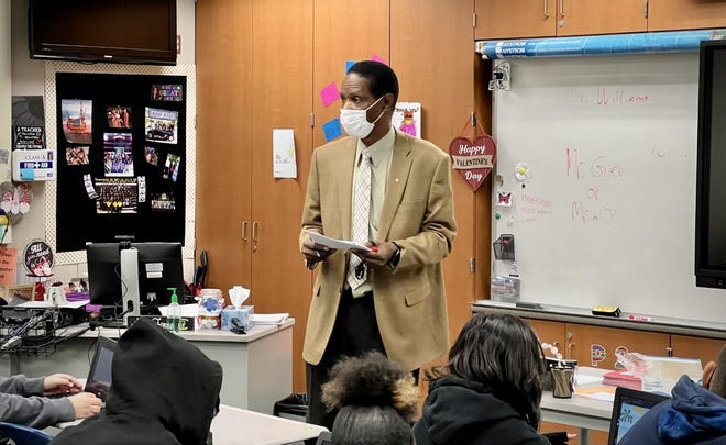 Ron Williams, superintendent of Victor Valley Union High School District, teaches a math class at Hook Junior High School to help cover a surge in absent teachers at the start of 2022.