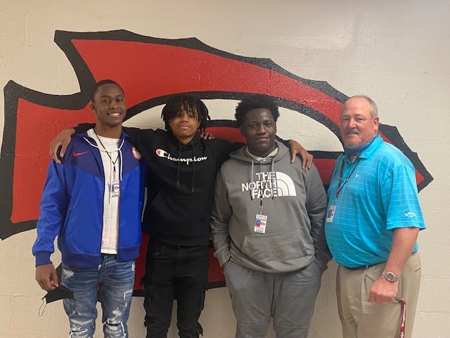 A team of students at Sumner Hill Junior High School recently took home first place for Region 3 in the Mississippi Stock Market Game, sponsored by the Mississippi Council for Economic Education. From left: Sumner Hill freshmen Zamarian Fanroy, Aaron Hickman and Jonathan Murphy with personal finance and accounting teacher Bradley Pope.