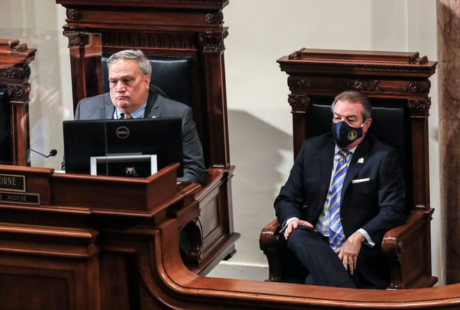 Senate President Robert Stivers, left, and House Speaker David Osborne listen during the governor's 2022 budget address at the state Capitol. Jan. 13, 2022