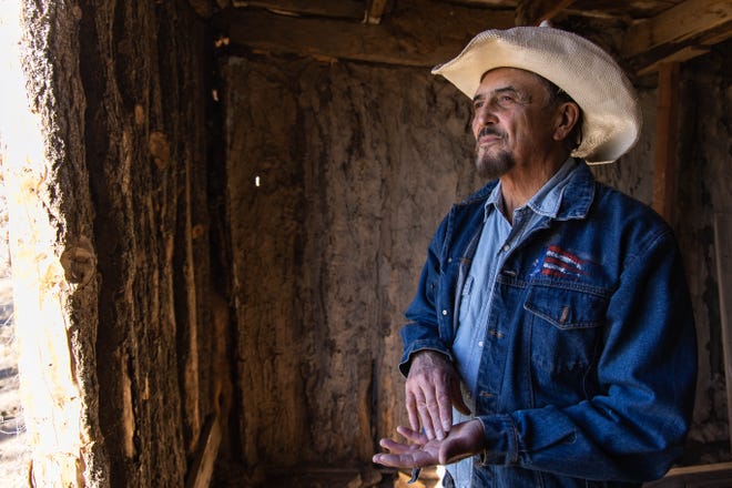 Paul Pino looks out the window of the old adobe homestead on the ranch of his ranch in Carrizozo on Wednesday, Jan. 12, 2020.