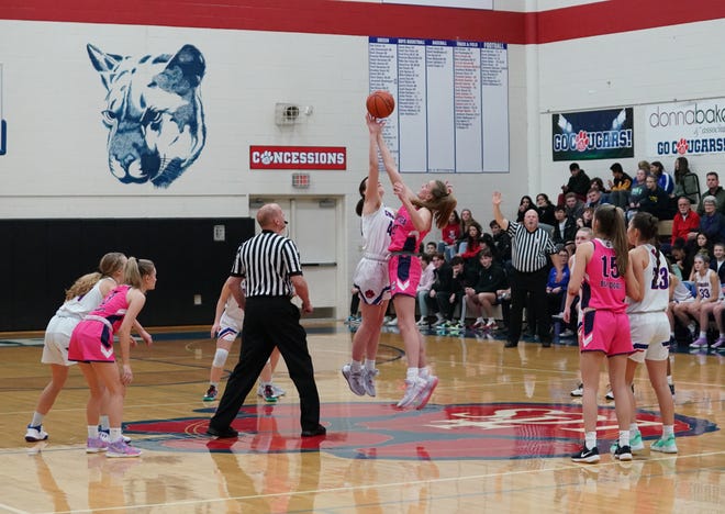 Lenawee Christian and Chelsea tip-off Friday's game at Lenawee Christian. [Telegram photo by Mike Dickie]