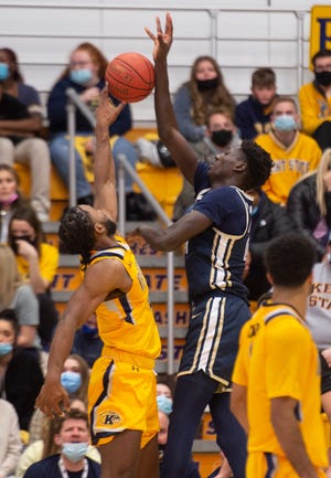 Kent State grad student guard Andrew Garcia, pictured blocking a shot against Akron, will guard Bowling Green senior standout Daeqwon Plowden during Saturday's game on the Falcons hardwood.