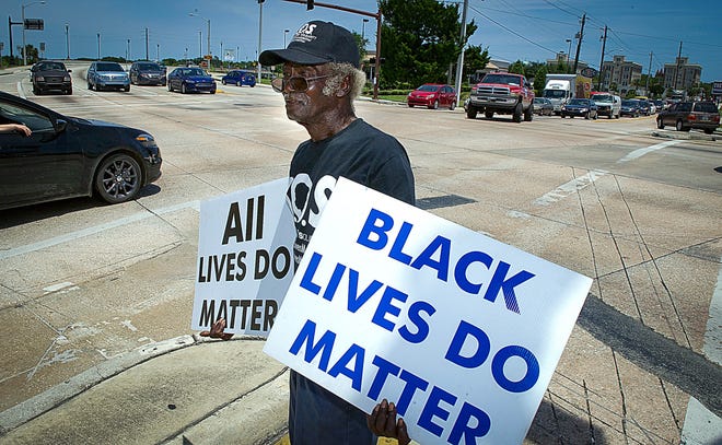 St. Augustine civil rights activist James Jackson protests police shootings in Louisiana and Minnesota and shootings of police officers in Dallas and Baton Rouge on the corner of U.S. 1 and King Street in St. Augustine in 2016.