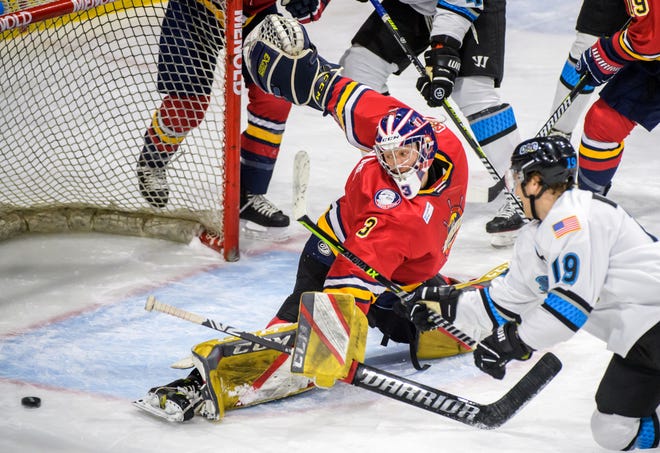 Rivermen goalie Eric Levine deflects the puck as Quad City's Taylor Price (19) chases during the second period Sunday, Jan. 16, 2022 at Carver Arena.