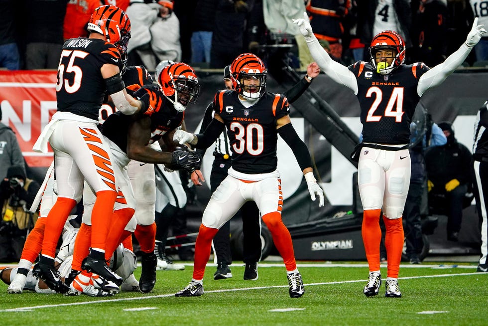 Cincinnati Bengals linebacker Germaine Pratt (57) and the Cincinnati Bengals defense celebrate PrattÕs interception to seal with win in the fourth quarter during an NFL AFC wild-card playoff game, Saturday, Jan. 15, 2022, at Paul Brown Stadium in Cincinnati. The Cincinnati Bengals defeated the Las Vegas Raiders, 26.19. to win the franchiseÕs first playoff game in 30 years. 