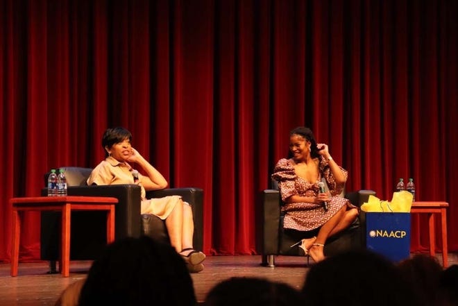 Guest Keke Palmer and host Chanta Haywood on stage at the Golden Torch Lecture series.