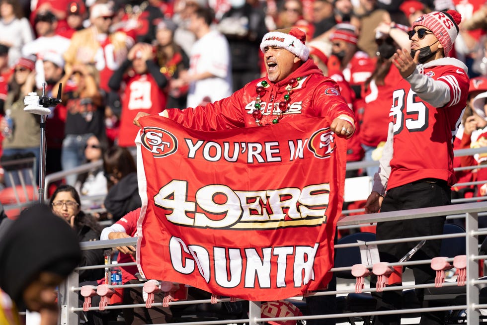 Dec 19, 2021; Santa Clara, California, USA;  San Francisco 49ers fan holds up a flag during the first quarter against the Atlanta Falcons at Levi's Stadium. Mandatory Credit: Stan Szeto-USA TODAY Sports