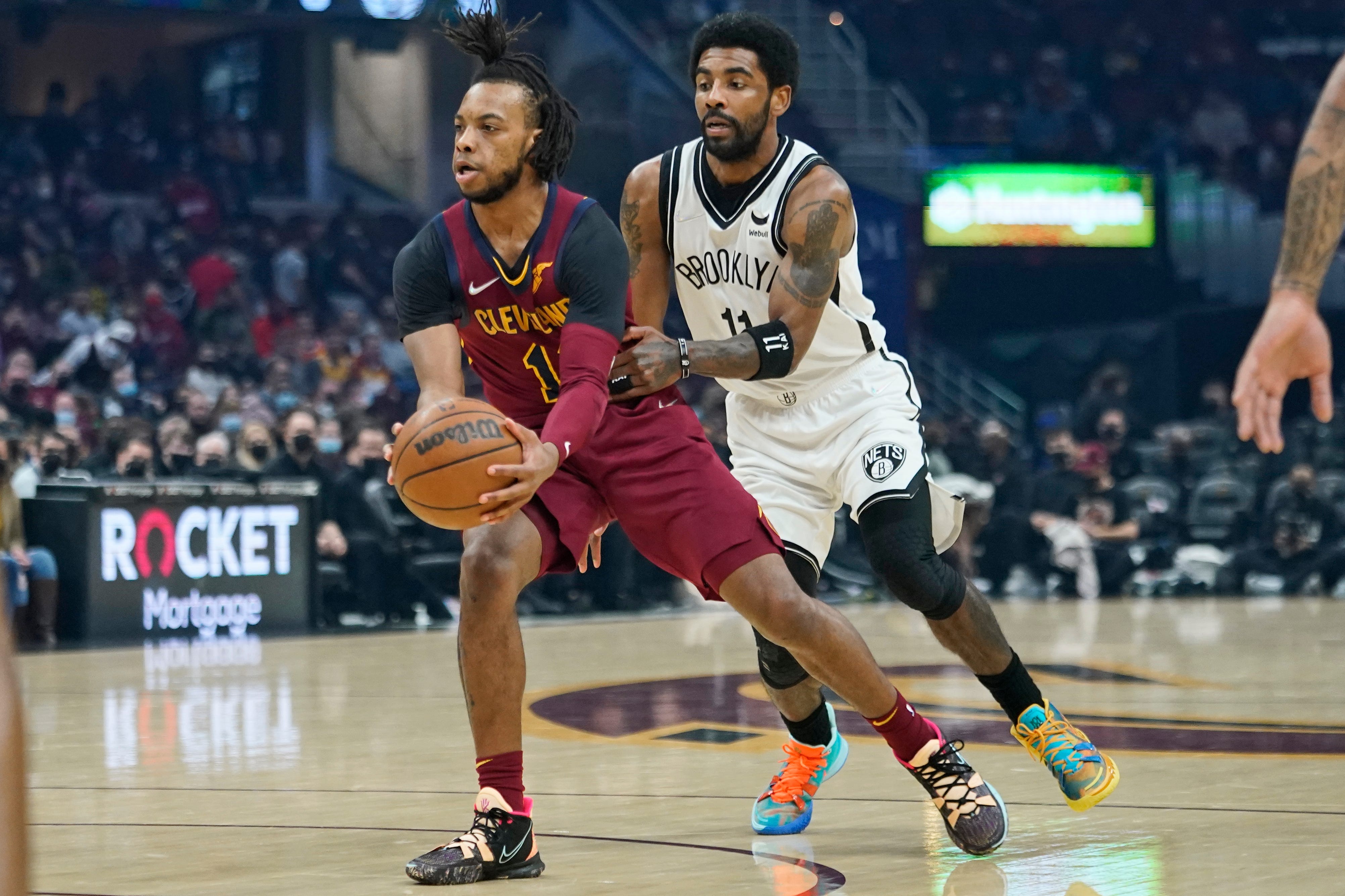 NBA fines Brooklyn Nets guard Kyrie Irving for verbal altercation with Cavs fan