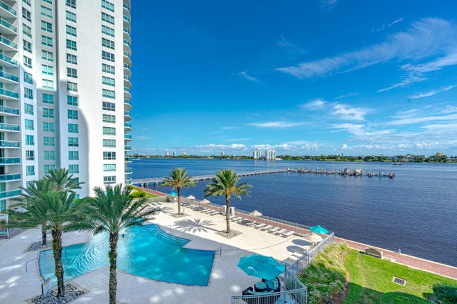 Enjoy spectacularly clear views of the Intracoastal Waterway from the dual-access private balcony on the fourth-floor dream home at Marina Grande on the Halifax in Holly Hill.