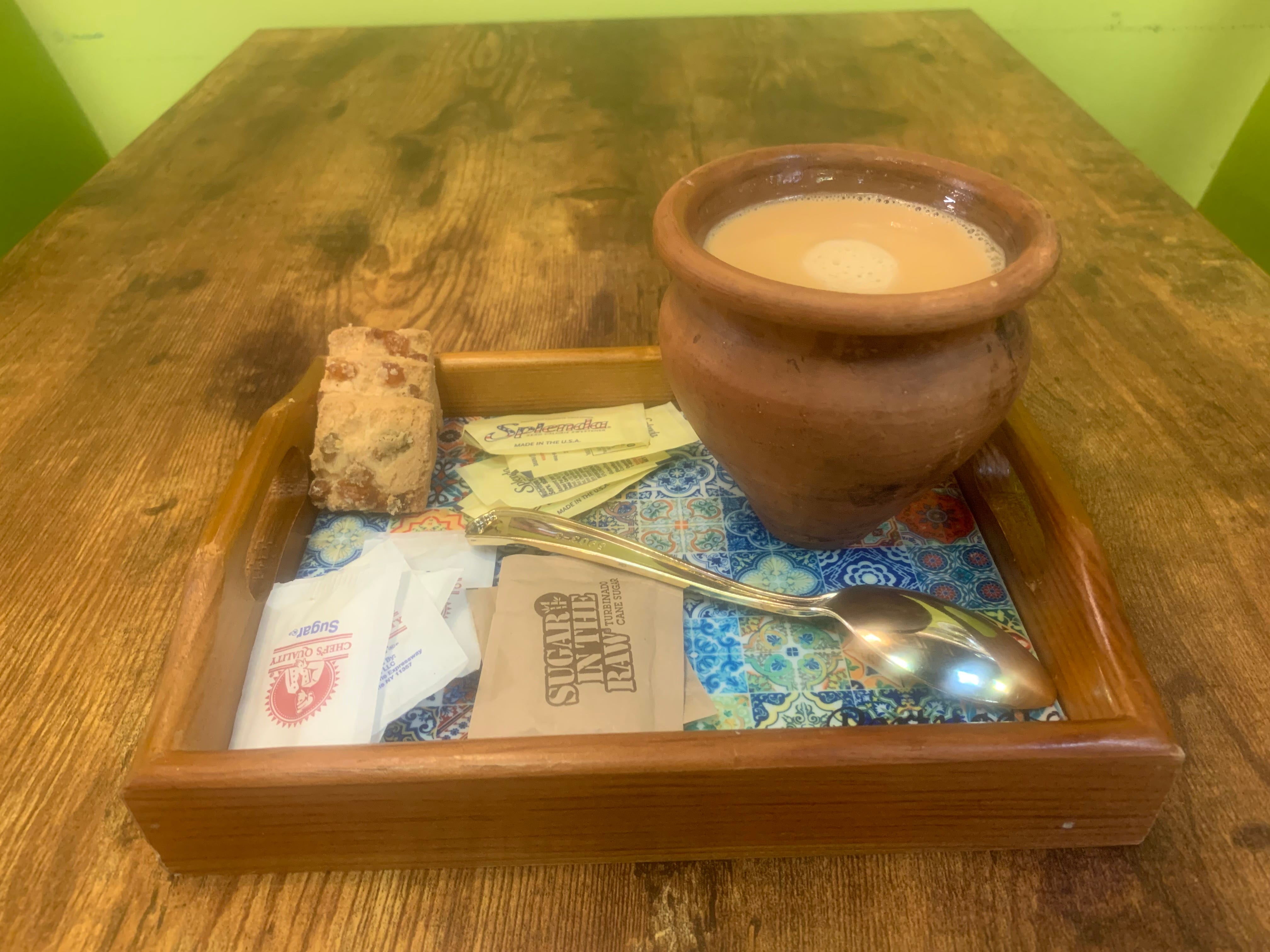 Karachi Kafe offers a Tandoori Kulhad chai — boiled tea in a tandoor (clay oven) and served in a kulhad (a handle-less clay cup).