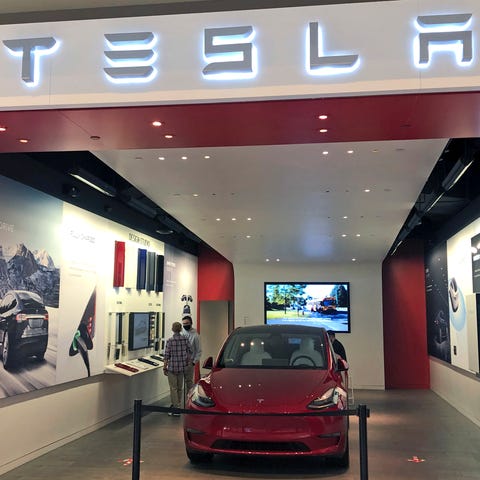 A Tesla car dealership store is seen at Ross Park 