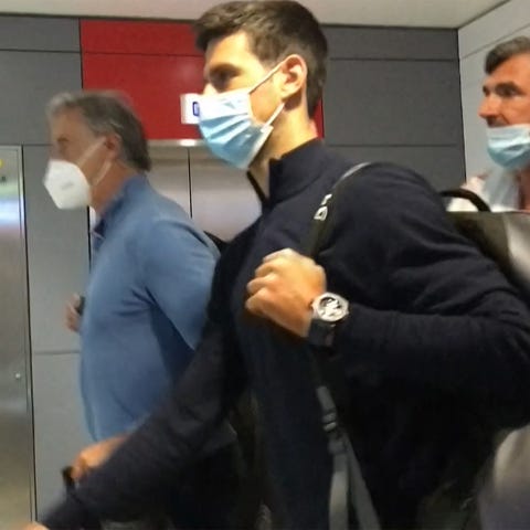 Novak Djokovic (disembarks from his plane at the a