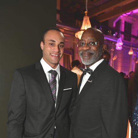 Edwin Moses and son Edwin Julian Moses attend the 