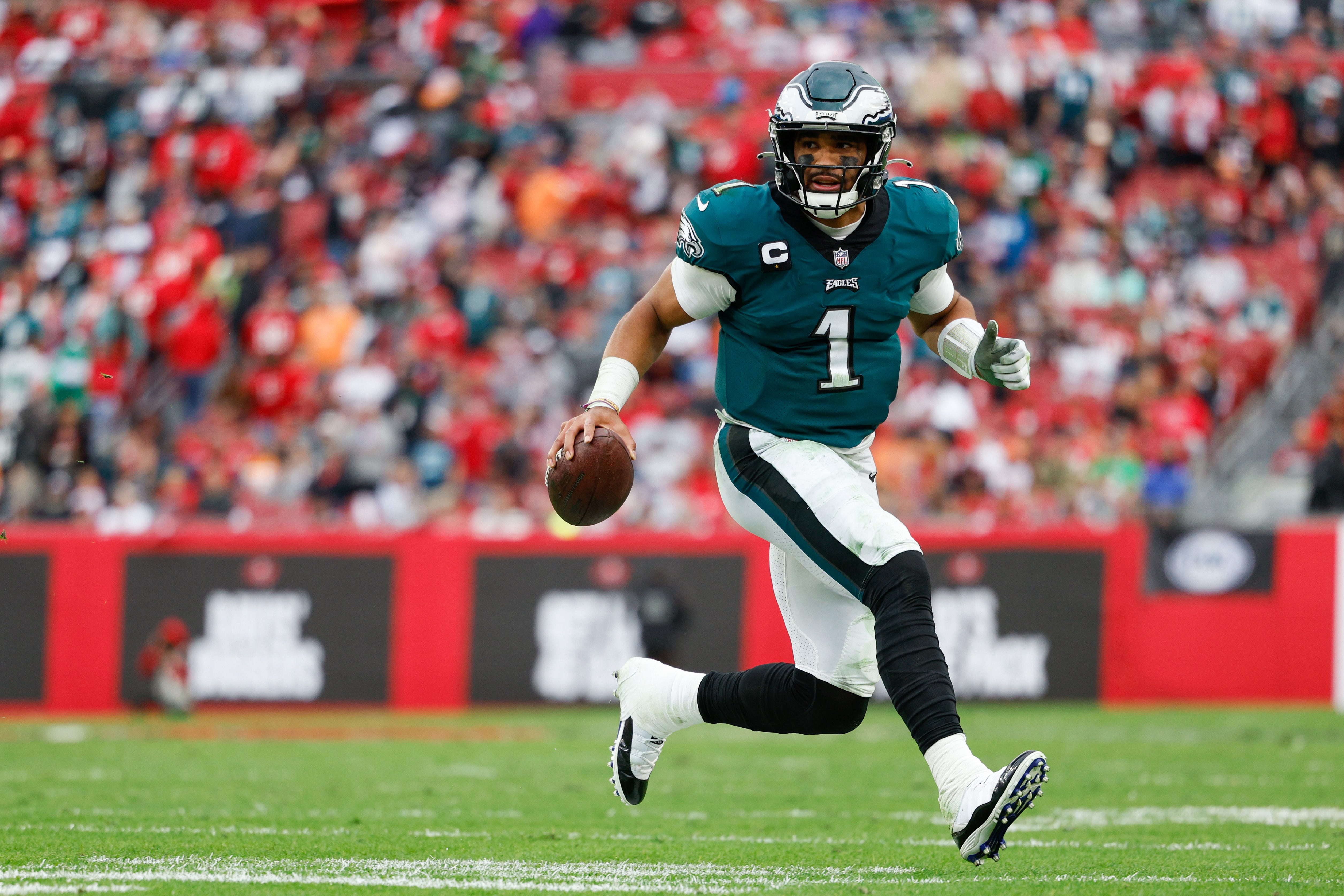 Eagles' Jalen Hurts, in a walking boot, determined to close the gap wit Tom Brady, Buccaneers