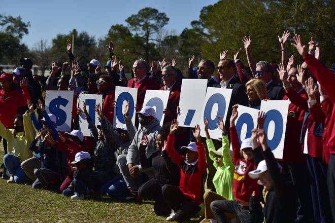 Officials of The Players Championship, Jaguars, Jumbo Shrimp, the city of Jacksonville and members of the Boys and Girls Club at the Clanzel Brown Community Center celebrate the announcement on Jan. 17 that The Players will donate $100,000 towards the construction of a putting green at the planned Clanzel Brown Sports Complex.