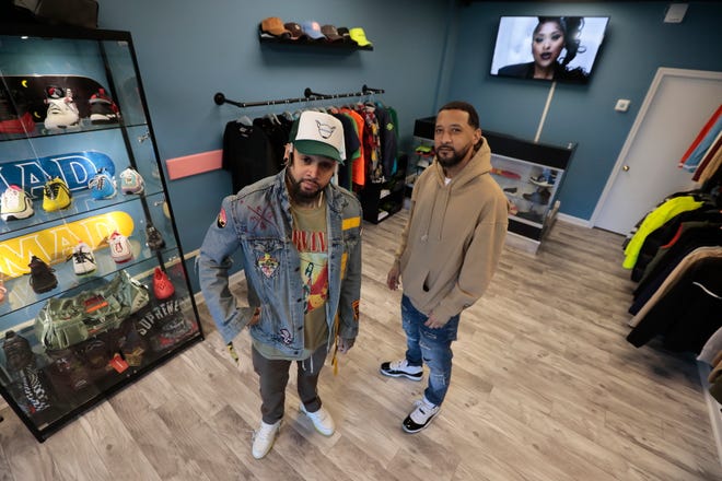 Co-owners Kashif Amar and Manuel Rozario at their new Los Perros clothing store on Acushnet Avenue in New Bedford.