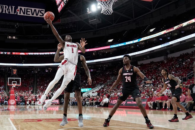 North Carolina State guard Dereon Seabron (1) drives to the basket against Louisville during the first half of an NCAA college basketball game in Raleigh, N.C., Saturday, Dec. 4, 2021. (AP Photo/Gerry Broome)