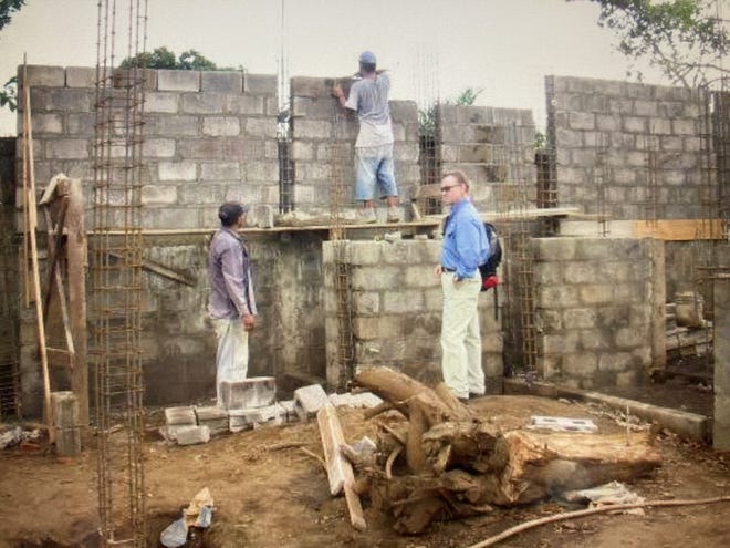 The Rev. James A. Setser, of Germantown, Ohio, gets updates from workers building churches in Nicaragua.