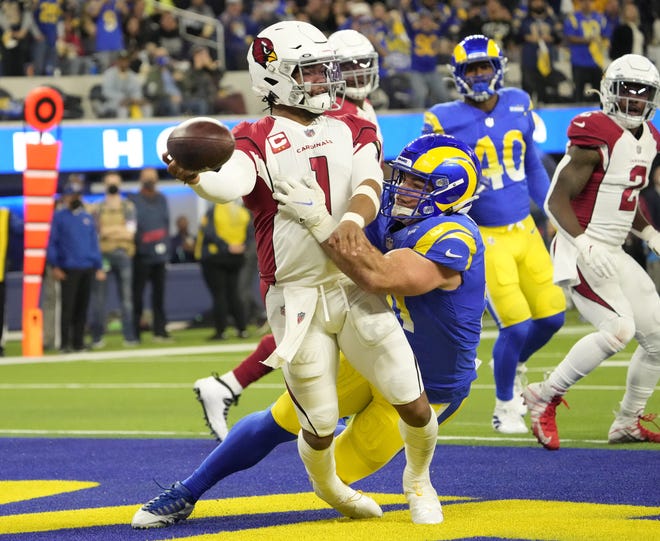 Jan 17, 2022; Los Angeles, California, USA; Arizona Cardinals quarterback Kyler Murray (1) throws the ball while brought down by Los Angeles Rams linebacker Troy Reeder during the second quarter of the NFC Wild Card playoff game. The ball was intercepted for a touchdown. Mandatory Credit: Michael Chow-Arizona Republic