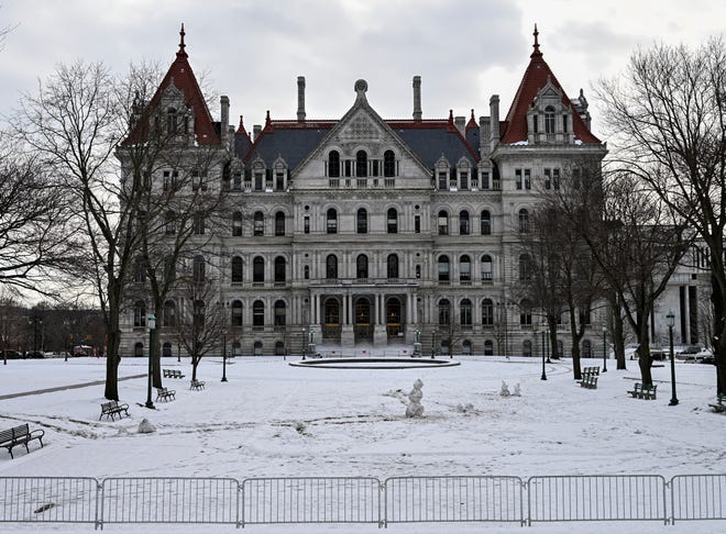 Snow surrounds the New York state Capitol, where Gov. Kathy Hochul will present her first executive state budget address in the Red Room Tuesday, Jan. 18, 2022, in Albany, N.Y. (AP Photo/Hans Pennink)