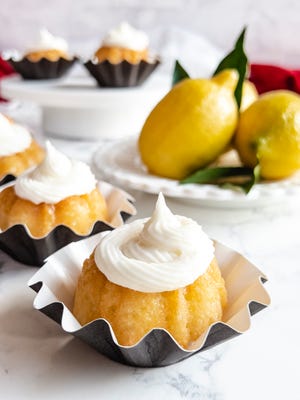 Mini Lemon Bundtlets  are dipped in a simple lemon syrup right out of the oven.