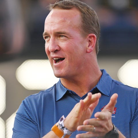 Peyton Manning claps as he is introduced before th