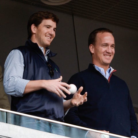 Eli (left) and Peyton Manning (right) added an alt
