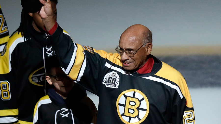 Former Boston Bruins player Willie O'Ree tips his hat as he is honored by the team in 2018.