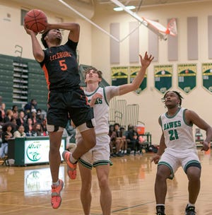 Leesburg's Andre Carter makes a basket during Tuesday's game against Lake Minneola High School in Minneola.