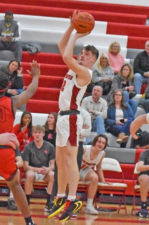 Coldwater’s Zach Coffing goes up for two in early season action.