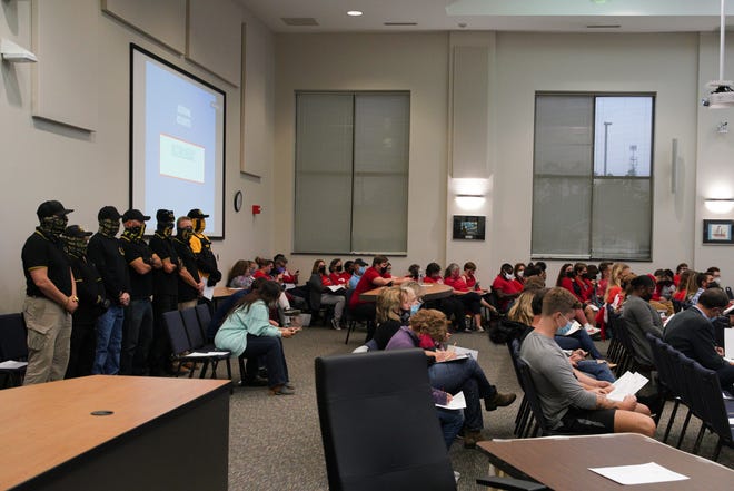 Community members attend a school board meeting on Tuesday, Nov. 9, 2021. Recent board meetings have drawn large crowds and filled public comment opportunities.