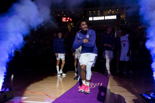 Evansville’s Shamar Givance (5) dances to the court ahead of the University of Evansville Purple Aces vs. Loyola Chicago Ramblers game at Ford Center in Evansville, Ind., Tuesday evening, Jan. 18, 2022. Loyola Chicago won 77-48.