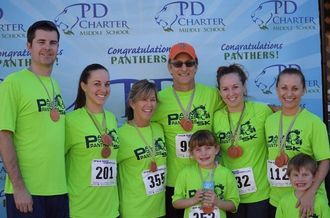 Jeff Montgomery, Mindy Montgomery, Debbi Geyer, Chris Geyer, Kaia Garvey, Kristin Colucci, Kate Albright and Haven Garvey take part in the Panther 5K, benefiting Palm Desert Middle School.