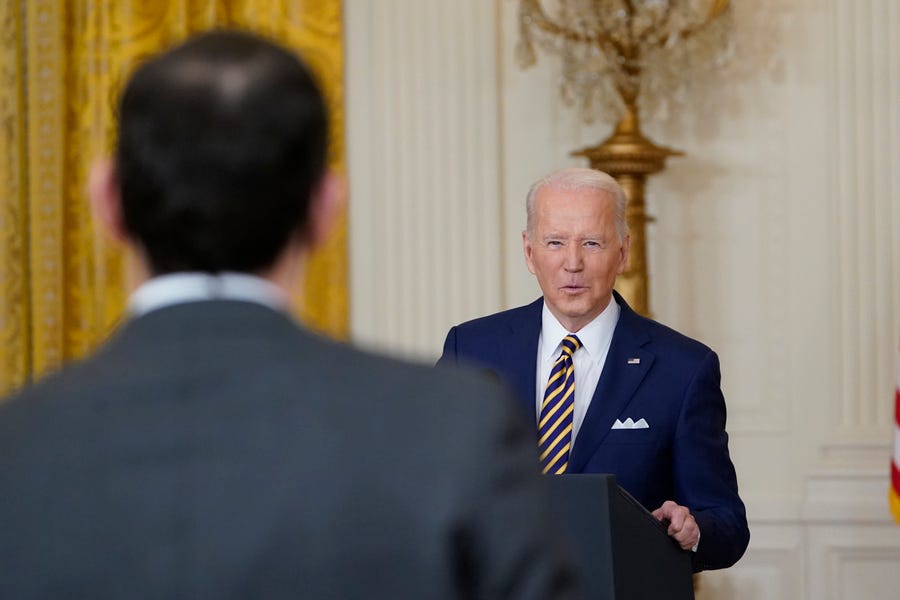 President Joe Biden calls on a reporter for a question during a news conference in the East Room of the White House in Washington, Wednesday, Jan. 19, 2022.