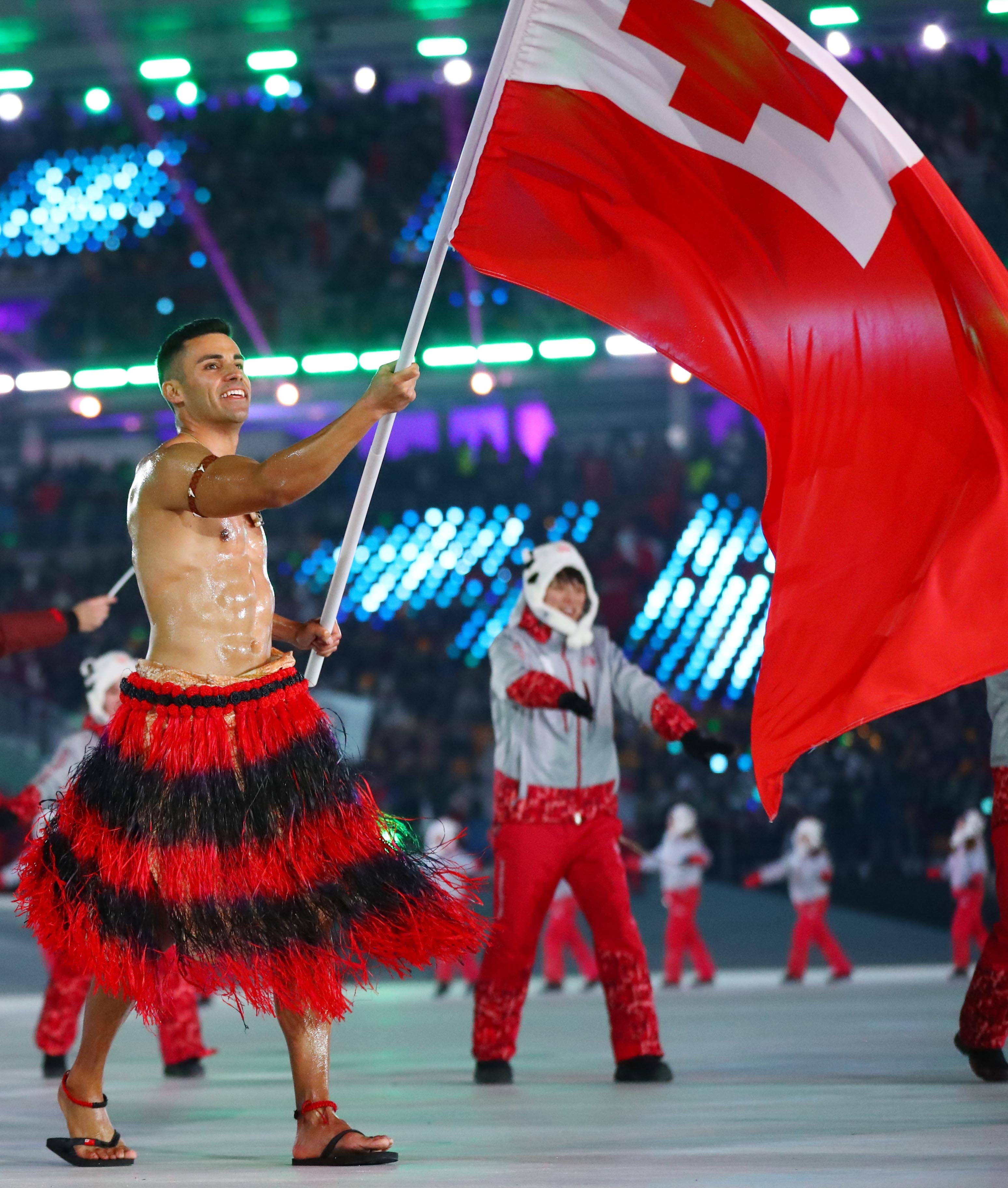 Olympian Pita Taufatofua – the viral shirtless Tongan – helps country recover from volcano
