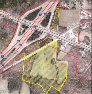 The area outlined in yellow on the map pictured shows the 35.05 acres of land along U.S. Highway 64 East that the Davidson County Board of Commissioners approved a rezoning request for Monday night so plans to build an industrial center there can move forward.